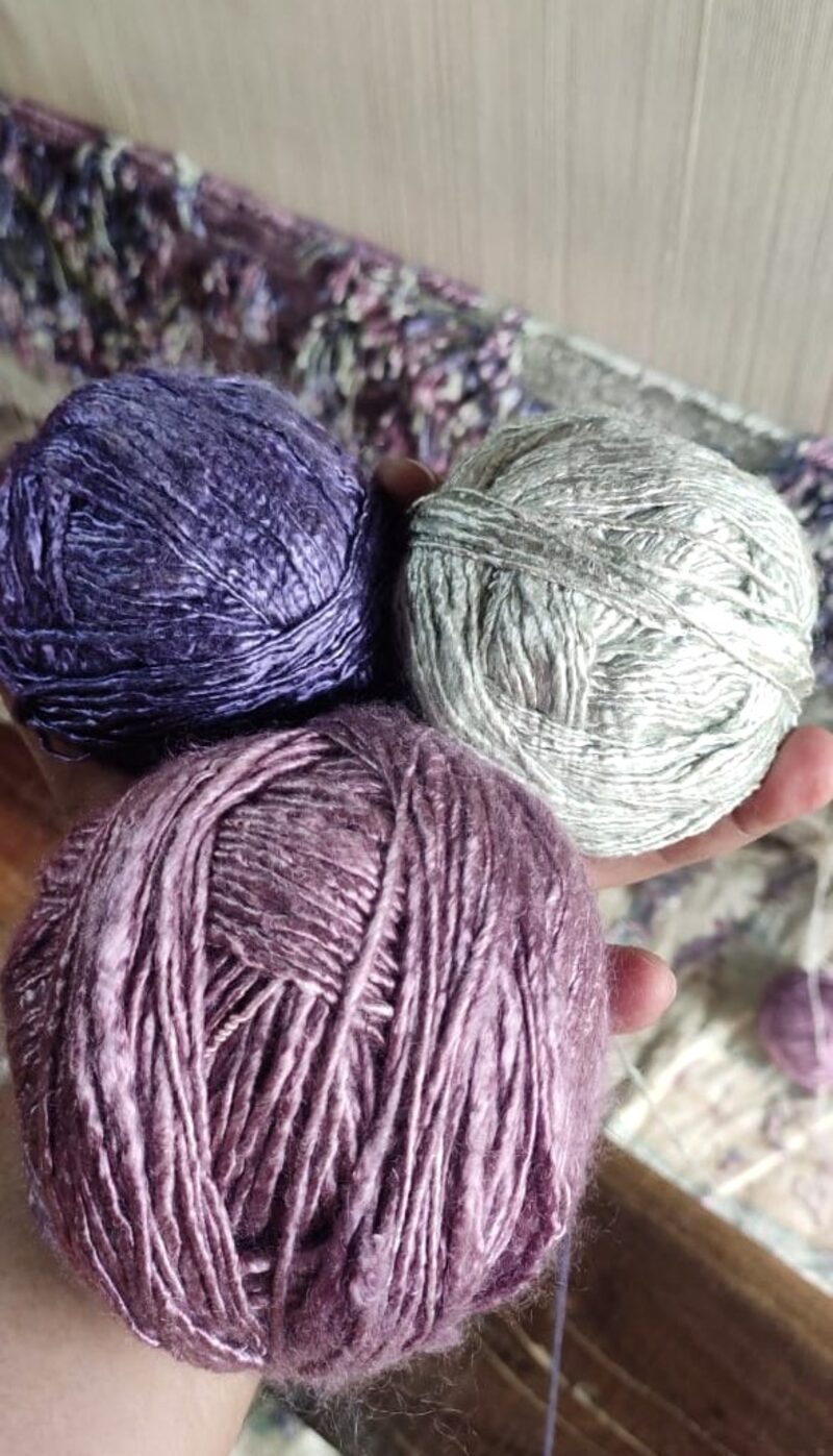 Bamboo silk yarn hanks dyed in the colours the design called for, laid out before spinning to the loom