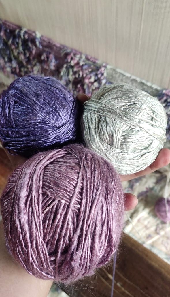 Bamboo silk yarn hanks dyed in the colours the design called for, laid out before spinning to the loom