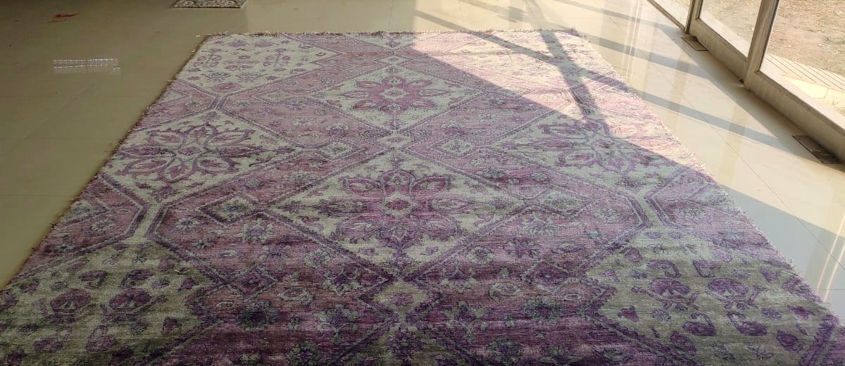 The finished bamboo silk rug, laid flat, measured and inspected before dispatch