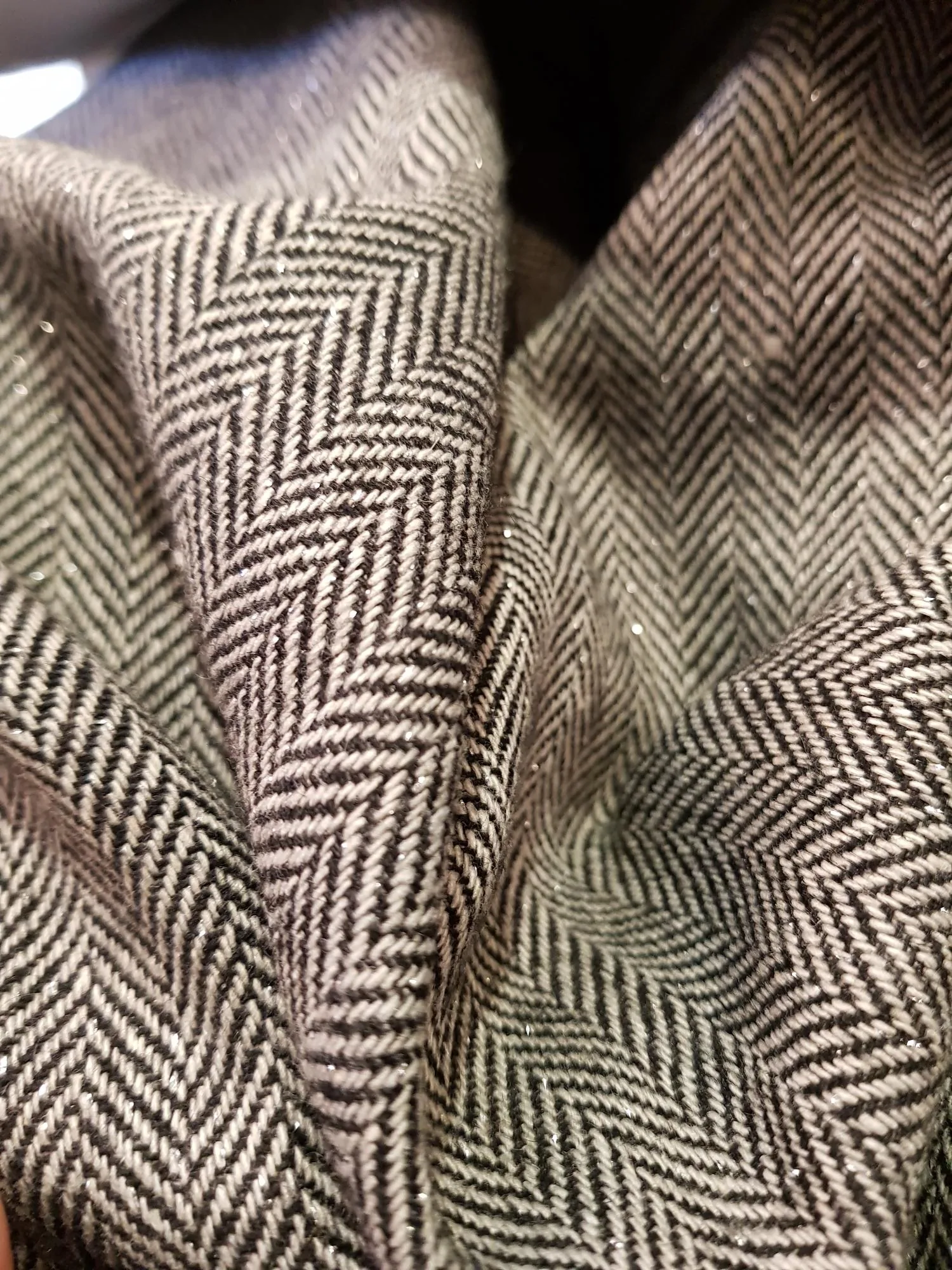Dark herringbone wool rug drape