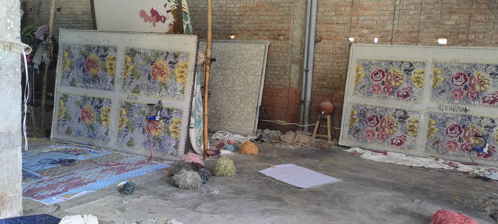 Fine hand-tufted rug in progress on the tufting frame at PiHue, Bhadohi