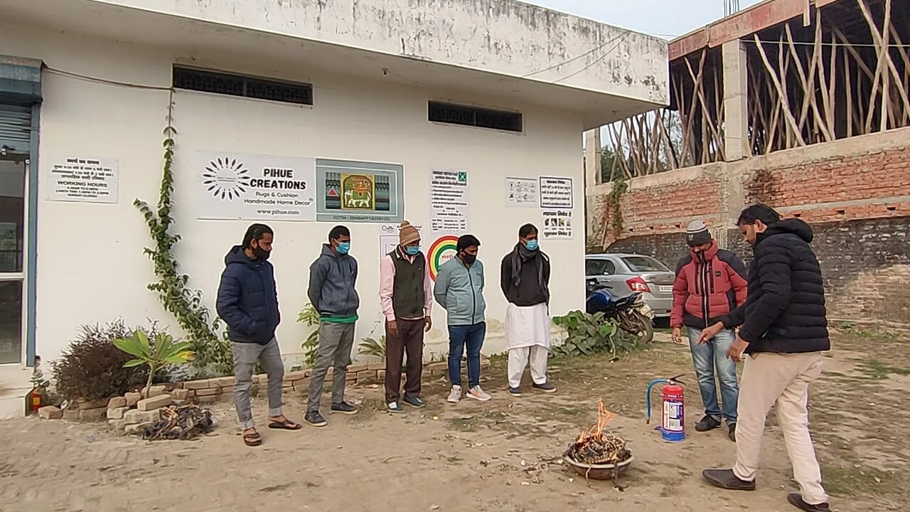 Workers gathered outside during a fire safety drill at the PiHue Bhadohi facility