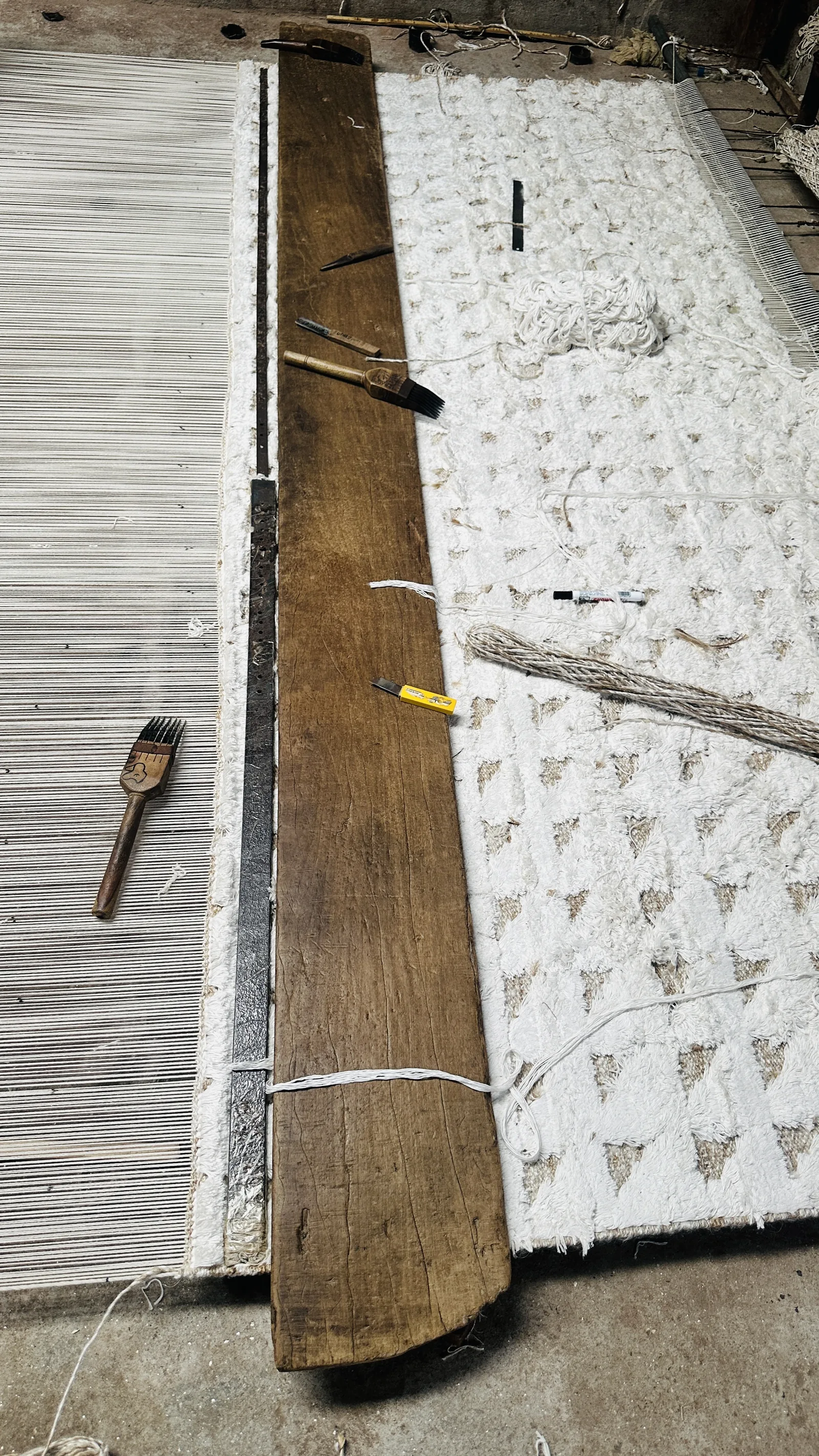 A flatweave rug in progress on the loom