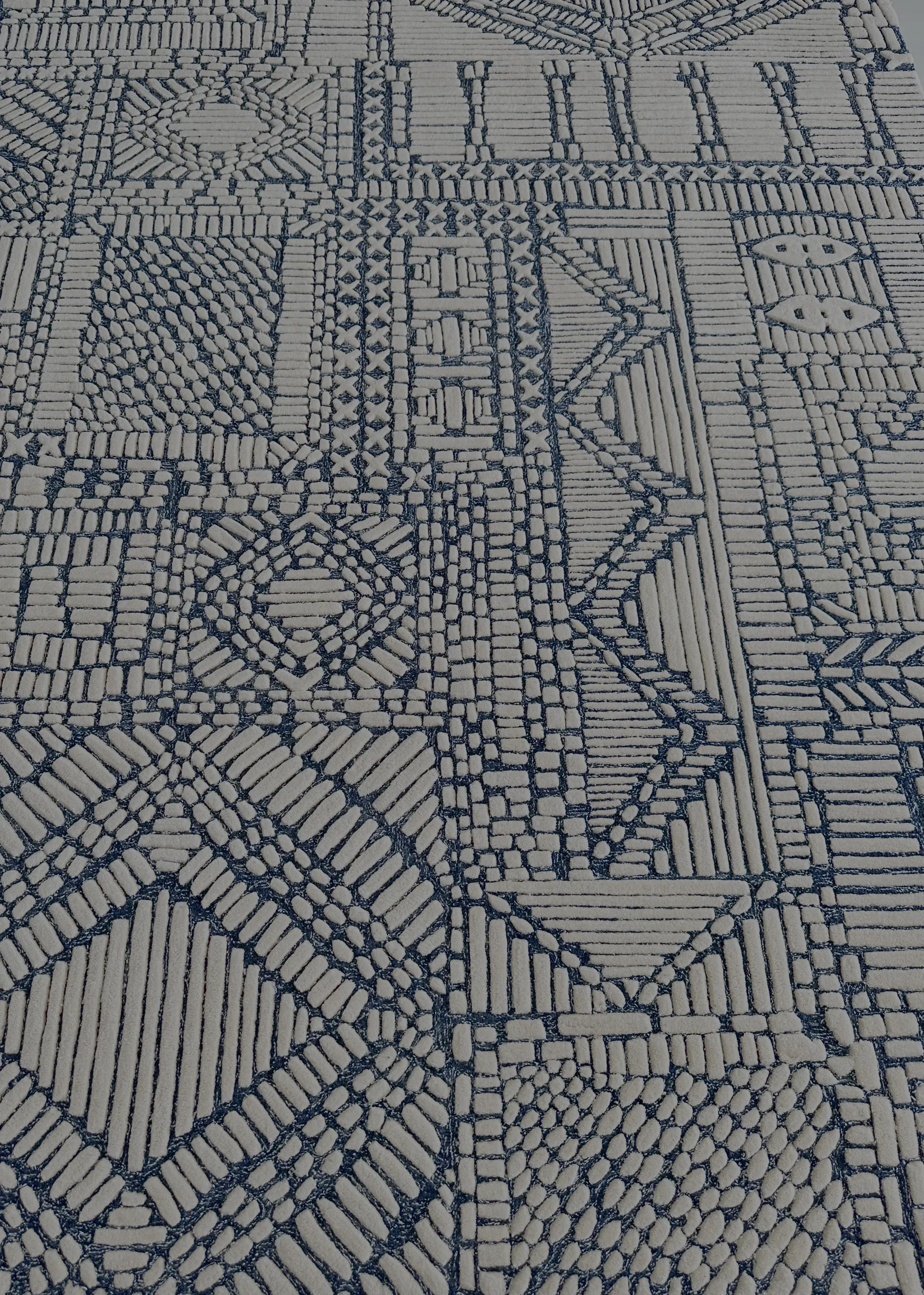 Hand-tufted carved wool rug on the QC bench at PiHue, Bhadohi