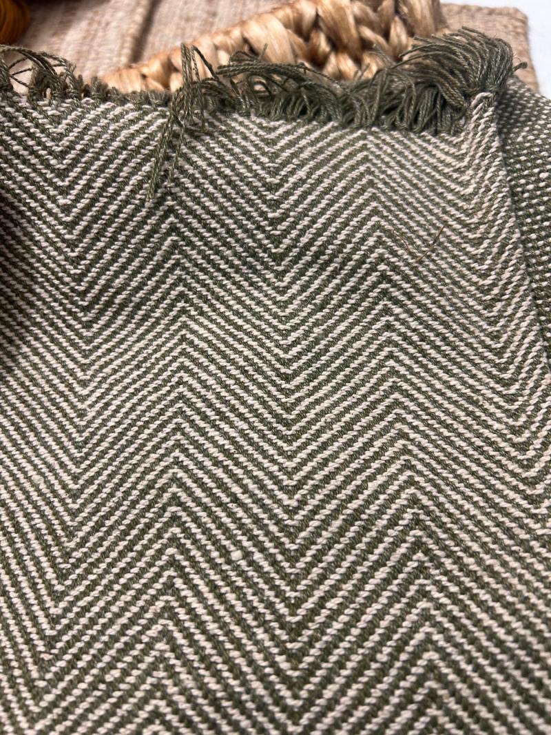 Olive and ivory herringbone linen flatweave with fringed edge