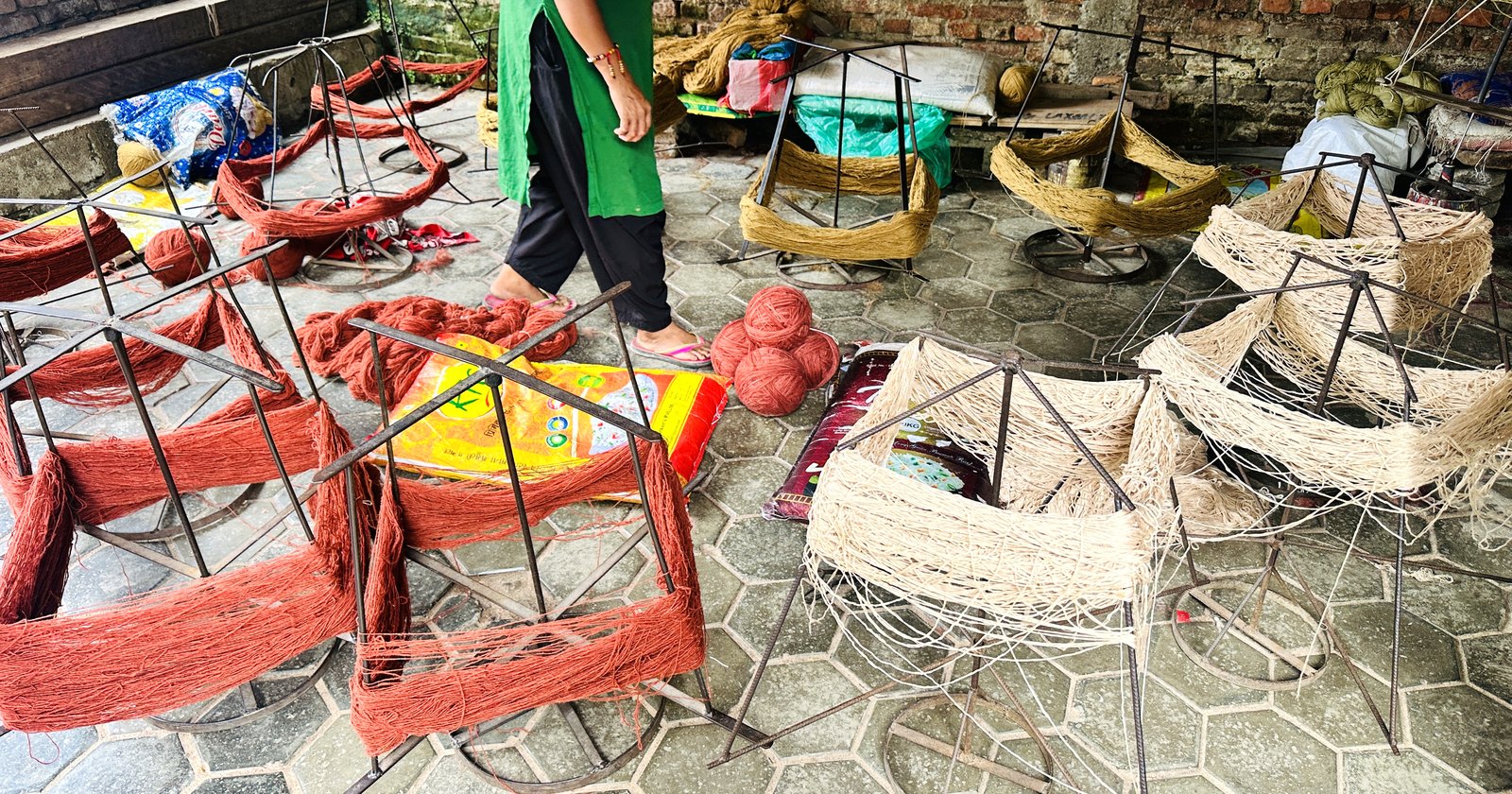 Stage 03 — dyed hanks on the drying yard after the contracted plant returns them