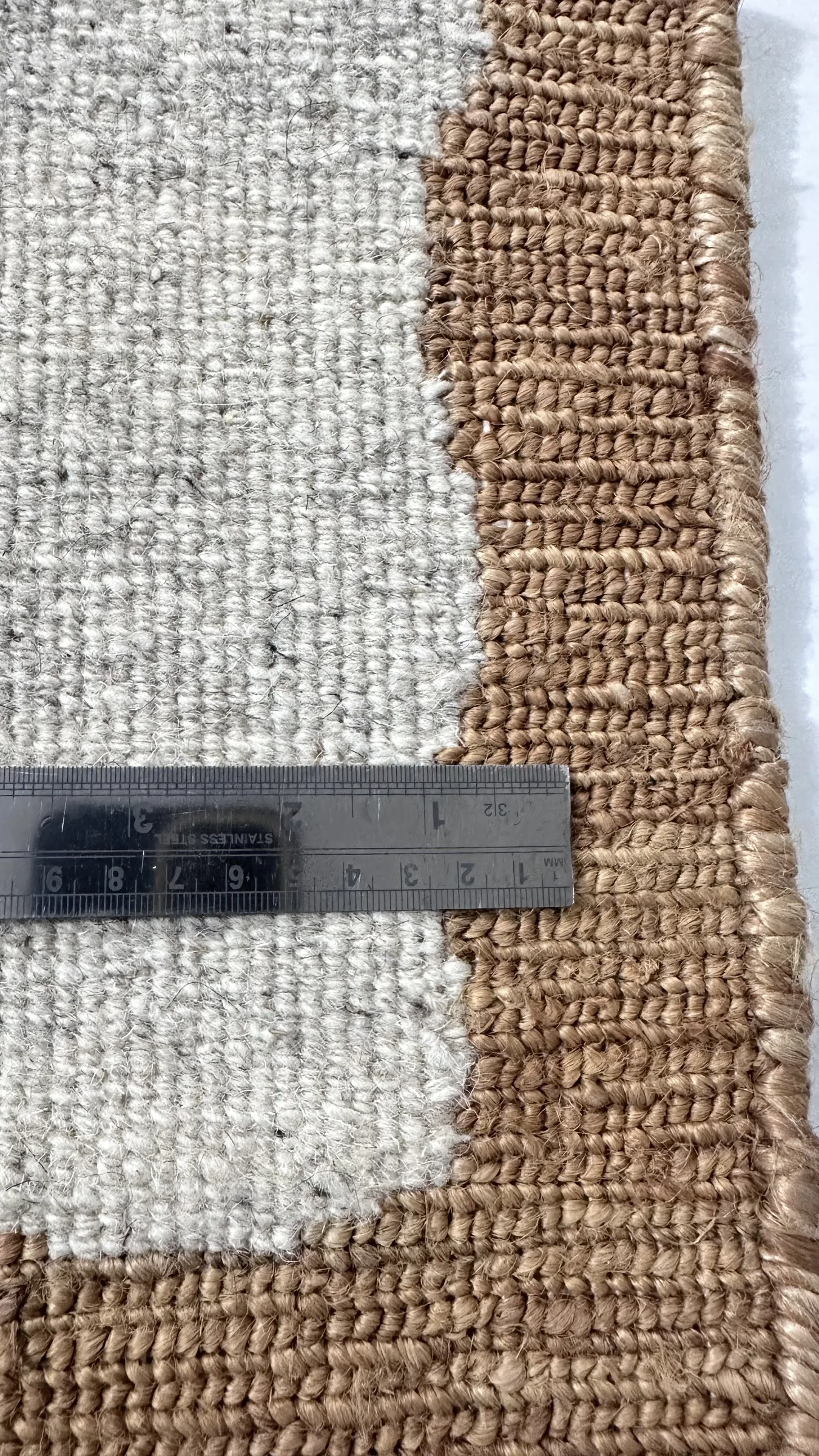 Macro of hand-knotted pile showing individual knots tied around warp threads
