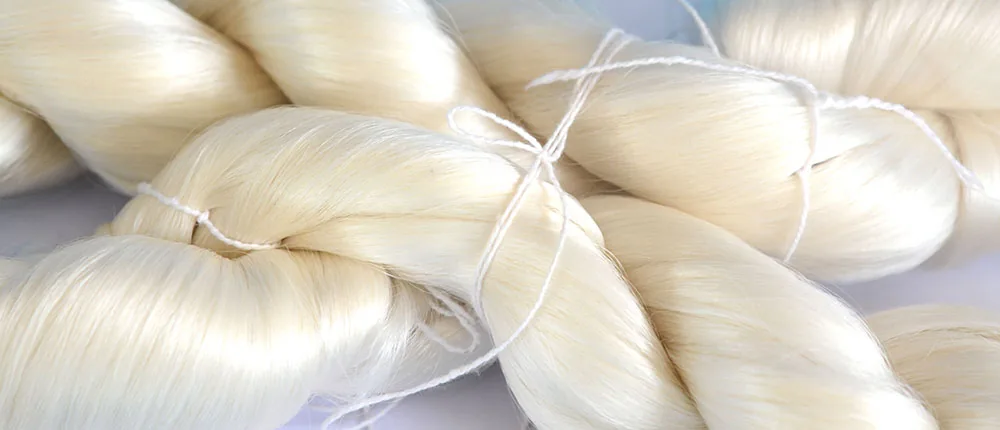 Reeled silk yarn hanks — five hundred metres of thread from one cocoon