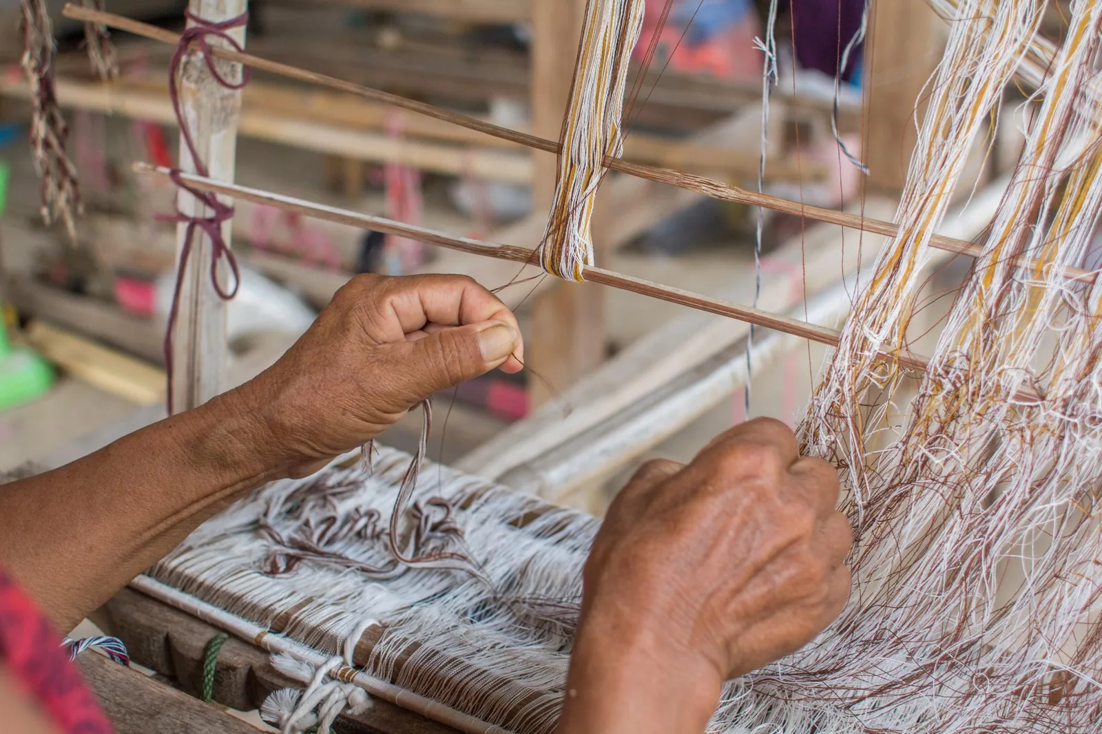 Warping the loom by hand